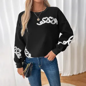 Women's black crewneck sweatshirt with white heart towel embroidery on sleeves and chest