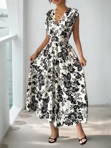Detailed view of elegant black floral print on white sleeveless V-neck summer dress
