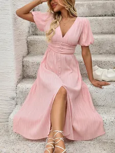 Detail showing the pleated V-neck waist and fabric buttons on pink puff sleeve midi dress