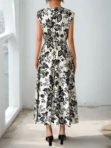 Rear view of vintage high-waist sleeveless maxi dress with black floral print on beige