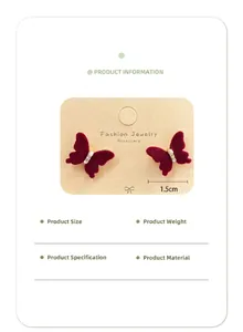 Detail view of red velvet bow earrings with small pearls and silver needles specifications