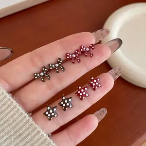 Polka dot bow and star stud earring set in deep red and brown for winter fashion
