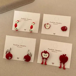 Festive red flocked apple earrings set with cute cartoon designs for Lunar New Year