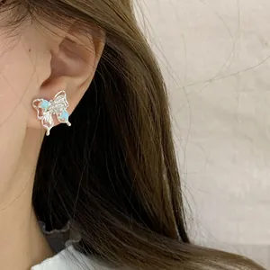 Orecchini a farfalla in argento con ali in smalto blu e zirconi rosa scintillanti