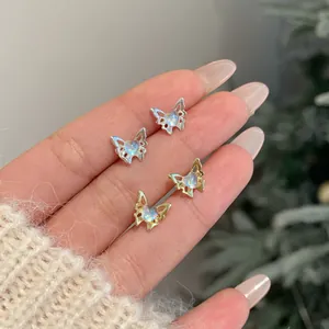 Elegant gold and silver laser butterfly stud earrings with iridescent heart stones