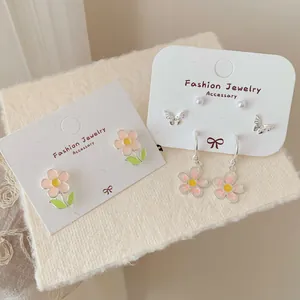 Pink sunflower earrings with green leaf and hollow butterfly studs in silver finish