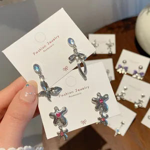Gothic style silver tassel flower earrings with colorful rhinestones and irregular charms