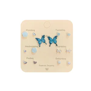 7-day colorful rose and butterfly earring set with pearls and rhinestones on display card