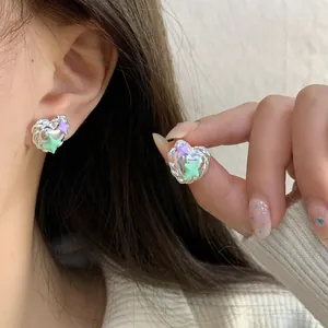 Delicate heart-shaped star earrings in purple and mint green with silver texture