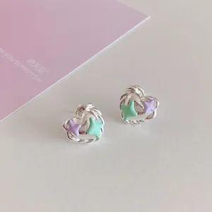 Silver twisted heart earrings with purple and mint green star accents for women