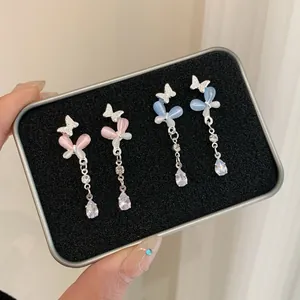 Elegant butterfly drop earrings with cat eye stone and crystal tassels in pink and blue