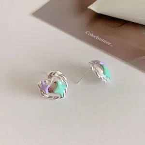 Pastel heart earrings with purple and green stars in a silver twisted metal frame