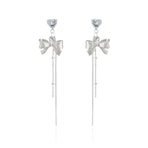 Silver bow earrings with long tassels and heart zircon stones for women's elegant fashion