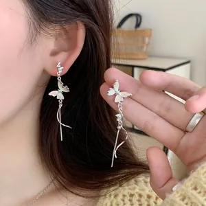Gradient butterfly earrings with long fringe tassels and silver pearls for a dreamy look