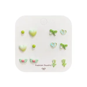 Set of 6 cute green stud earrings featuring bear, heart, and tulip designs for women