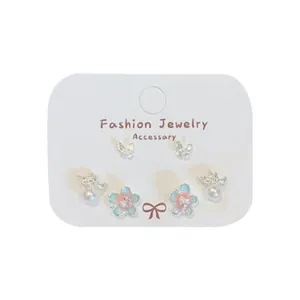 Parure de boucles d'oreilles papillon et fleurs menthe mambo avec aiguilles en argent