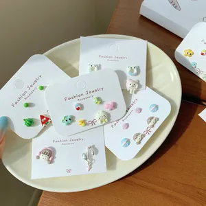 Cute cartoon watermelon and animal earring set displayed on jewelry cards