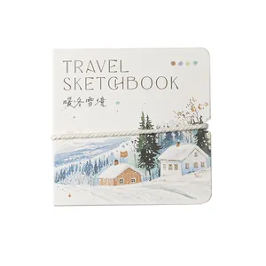 Taccuino da viaggio con illustrazione di paesaggi invernali e fascia elastica bianca