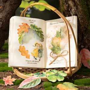 Nature themed leaf stickers and forest girl scrapbooking decals on a vintage journal