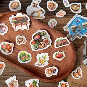 Gourmet food scrapbooking stickers featuring world cuisine and chefs on a wooden tray