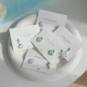 Sea star and shell zircon earring set with 5 pairs in light blue and pearl finishes