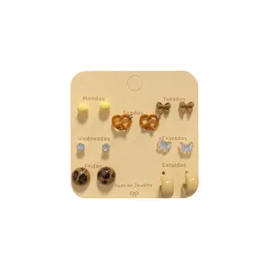 7-day weekly stud earrings set featuring leopard print and cute shapes on display card