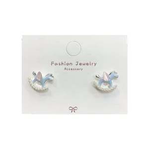 Cartoon rocking horse stud earrings with light blue enamel and small white pearls