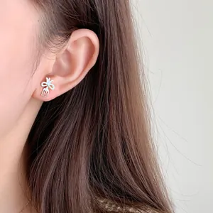 Cute dopamine fork-shaped earrings with light blue enamel bow on silver metal studs