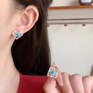Vintage bohemian silver sun flower stud earrings with turquoise stone and hollow design