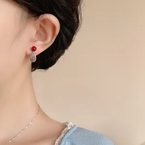 Retro cherry red bead and silver drop earrings set on model for vintage elegant style