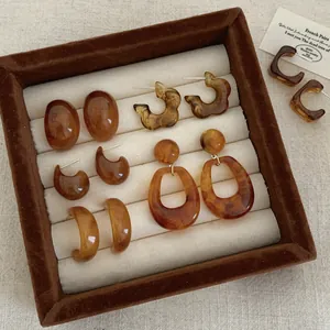 Retro amber resin earring set with tortoiseshell pattern in a brown jewelry box