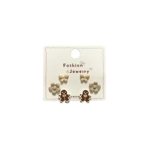 Cute cartoon stud earring set featuring gingerbread man and floral designs