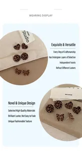 Detail of leopard print flocked heart and round stud earrings with bow accent