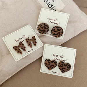 Chic leopard print earring set featuring heart, bow, and round flocked designs for women