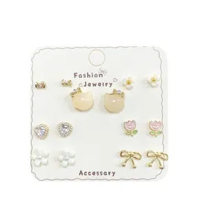 Set of 6 pairs dainty gold-plated earrings featuring butterfly, flower and heart designs