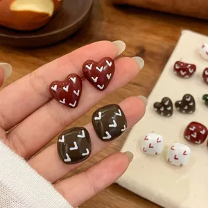 Retro colorful heart and square earrings with white chevron patterns on studs
