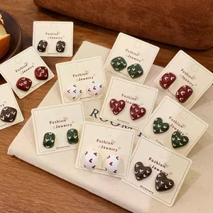 Retro colorful geometric enamel heart earrings collection on minimalist beige cards