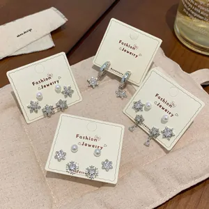 Snowflake stud earring set with zircons and pearls for women in silver finish