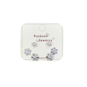 Three-piece snowflake stud earring set with zircons and pearls on white display card