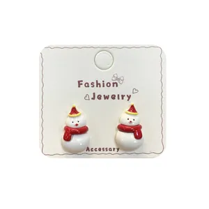 Cartoon snowman stud earrings with red scarf and hat on fashion jewelry display card