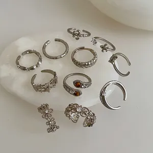 10-teiliges Vintage Silberring-Set mit Zirkon-Blumen Sternen und Tigerauge-Steinen verziert