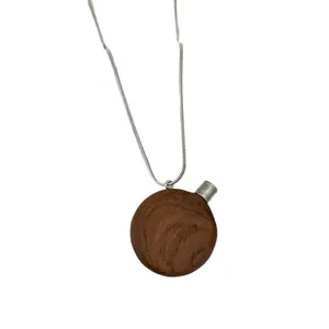 Collier pendentif bouteille de parfum ronde en bois vintage avec chaîne argent