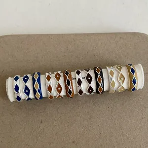 Vintage enamel geometric rings set featuring colorful diamond patterns and retro gold finish