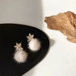 Winter snowflake drop earrings with golden metal and soft beige pompom charms