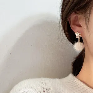 Winter snowflake drop earrings with white fur balls and sparkling zircon accents