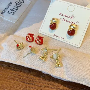Festive red lucky cat and fortune bag stud earring set with gold finish for New Year