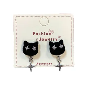 Asymmetric black flocking cat earrings with silver star pendants and rhinestone eyes