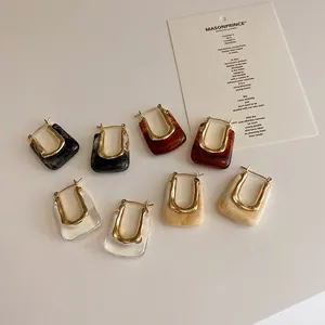 French vintage geometric U-shaped earrings set with resin and gold polished metal