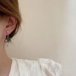 Minimalist silver metallic ball tassel earrings for women with elegant long chain drop