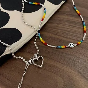 Collier double épaisseur avec perles de cristal colorées, smiley et pendentif coeur argenté